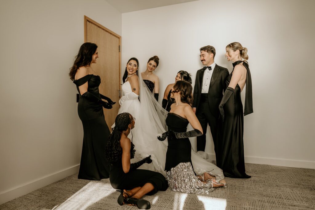 Bridal party gathered around the bride.
